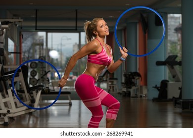 Middle Age Woman Playing Around With Hula Hoop Rings