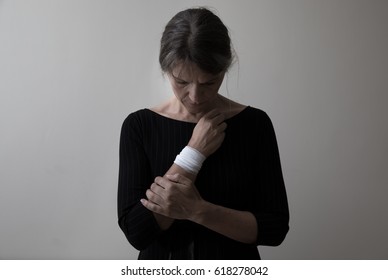 Middle Age Woman Showing The Scars Of Self Harm.