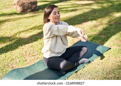 Middle Age Woman Smiling Confident Stretching At Park