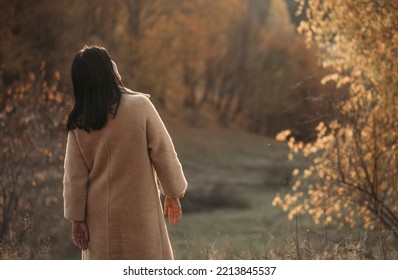 Middle Age Woman Stretching Arms Breathing Fresh Air In A Forest In Autumn