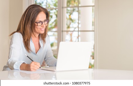 Middle Age Woman Using Laptop Computer, Indoor