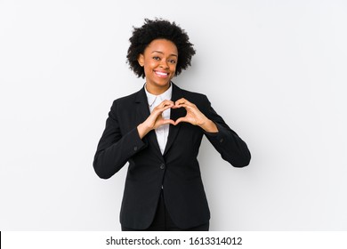 Middle Aged African American Business  Woman Against A White Background Isolated Smiling And Showing A Heart Shape With Hands.