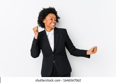 Middle Aged African American Business  Woman Against A White Background Isolated Dancing And Having Fun.