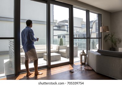 Middle Aged Arab Man Drinking Coffee In His City Apartment