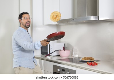 Middle Aged Arab Man Flipping A Pancake