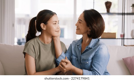 Middle aged asia people old mom love care trust comfort help young teen talk crying stress relief at home. Mum as friend listen adult child woman feel pain sad worry of broken heart life crisis issues - Shutterstock ID 2274179841