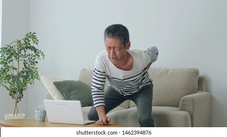 Middle Aged Asian Man Having A Low Back Pain.