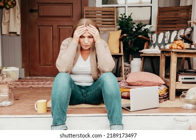 Middle Aged Beautiful Woman Plus Size Model In Jeans And Knitted Cardigan And Dog Sit On Porch Rustic Country Cosy House Using Laptop, Loss Of Job And Income, Mental Health, Online Work