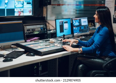 Middle Aged Beautiful Woman Working In A Broadcast Control Room On A Tv Station. Entertainment News With Footage Equipment Concept.