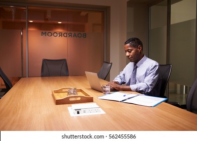 Middle aged black businessman working late alone in office - Powered by Shutterstock