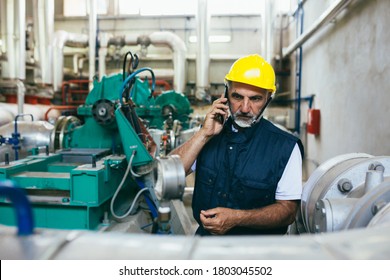 Middle Aged Blue Collar Worker Working In Heat Plant