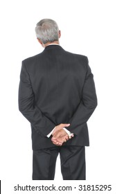 Middle Aged Businessman with his hands behind back Head tilted to one side isolated over white