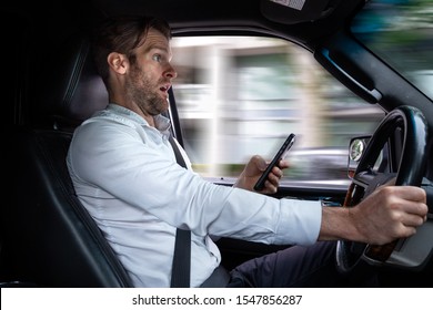 A Middle Aged Caucasian Man Distracted Driving While Using A Mobile Device Stops His Vehicle Suddenly To Avoid An Accident.