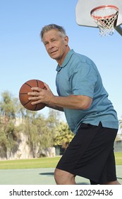 Middle Aged Caucasian Man Playing Basketball
