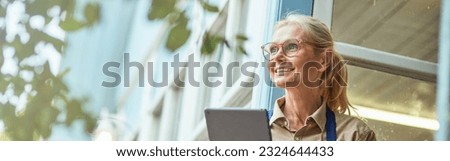 Middle aged caucasian woman near garden house
