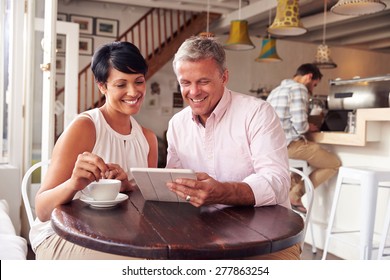 Middle Aged Couple In A Cafe