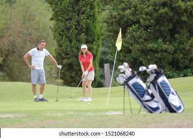 Middle Aged Couple On Golf Course