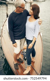 Middle Aged Couple On An Old Boat