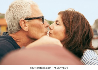 Middle Aged Couple On An Old Boat