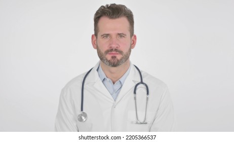 Middle Aged Doctor Showing Yes Sign By Head Shake, White Background