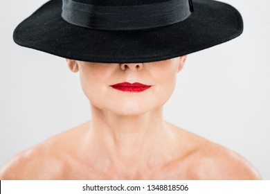 Middle Aged Elegant And Fashionable Woman With Red Lips In Black Hat Isolated On Grey 