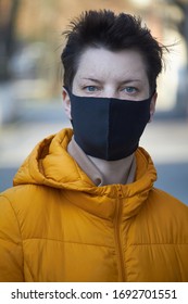 Middle Aged European Woman In Protective Black Mask, Woman Wearing Mask During Coronavirus COVID-19 Epidemic. Sick Woman Wearing Protection During Pandemic.