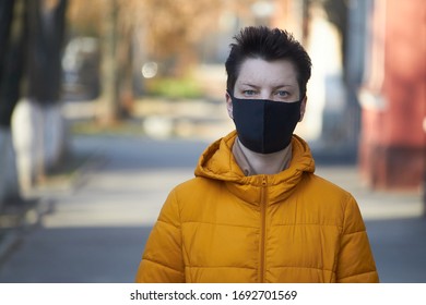 Middle Aged European Woman In Protective Black Mask, Woman Wearing Mask During Coronavirus COVID-19 Epidemic. Sick Woman Wearing Protection During Pandemic.