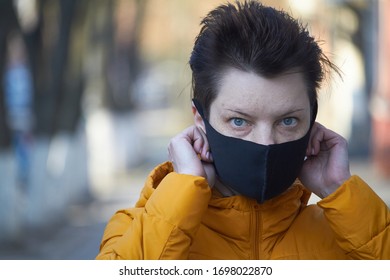 Middle Aged European Woman In Protective Black Mask, Woman Wearing Mask During Coronavirus COVID-19 Epidemic. Sick Woman Wearing Protection During Pandemic.