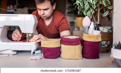 Middle Aged Father Working On Sewing Machine And Upcycling Old Color Jeans To Stylish Crafted Fabric Basket, Creative Tailor Workshop, Zero Waste Home Decor, Indoor Lifestyle