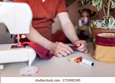 Middle Aged Father Working On Sewing Machine And Upcycling Old Color Jeans To Stylish Crafted Fabric Basket, Creative Tailor Workshop, Zero Waste Home Decor, Indoor Lifestyle