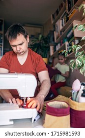 Middle Aged Father Working On Sewing Machine And Upcycling Old Color Jeans To Stylish Crafted Fabric Basket, Creative Tailor Workshop, Zero Waste Home Decor, Indoor Lifestyle