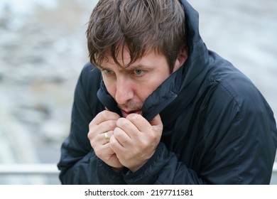 Middle aged handsome man in cold day outdoors.Too cold. Concept of leisure time, cold weather during winter season. He's trying to wrap himself up. Portrait, front view. Close up. Walking without hat. - Shutterstock ID 2197711581