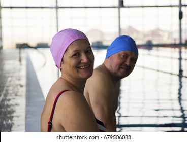 Middle Aged Happy Couple In Swimming Pool