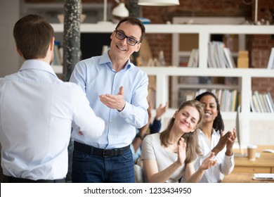 Middle Aged Happy Smiling Boss, Mentor Congratulating Employee, Praise For Good Work, New Project, Idea For Startup, Shaking Hand, Welcoming New Member Of Business Team, Colleagues Applauding