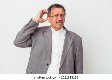 Middle aged indian business man isolated on white background being shocked, she has remembered important meeting.