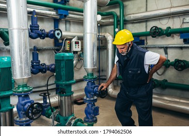 middle aged industry worker having injury on work - Powered by Shutterstock