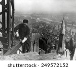 Middle aged iron worker at the Empire State Building construction site, 1930. The Chrysler Building