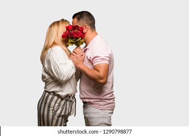 Middle aged latin couple celebrating valentines day - Shutterstock ID 1290798877
