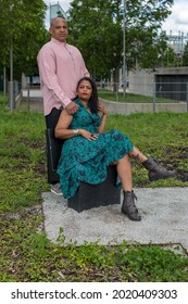 Middle Aged Latin Couple Dressed Casually Pink Shirt And Green Dress