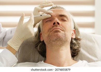 Middle Aged Male Client During Filler Injections In Aesthetic Medical Clinic