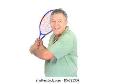 Middle Aged Man About To Make A Backhand In Tennis.