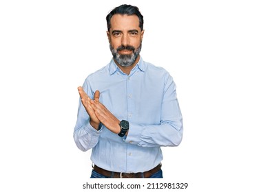 Middle Aged Man With Beard Wearing Business Shirt Clapping And Applauding Happy And Joyful, Smiling Proud Hands Together 