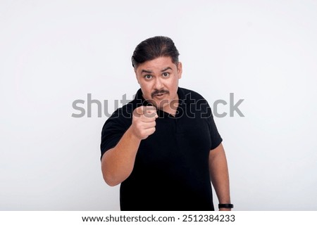 A middle aged man being forthright and direct, giving a blunt warning at someone. Pointing his finger in an authoritative way. Set against a white background.