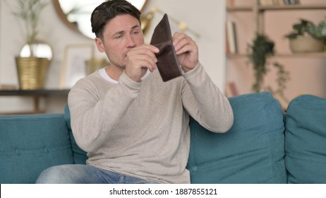 Middle Aged Man Checking Empty Wallet, no Money
