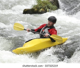 A Middle Aged Man Doing The Extreme Sport Of Kayaking, Motion Blur