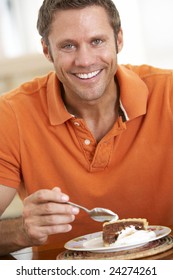 Middle Aged Man Eating Chocolate Cake