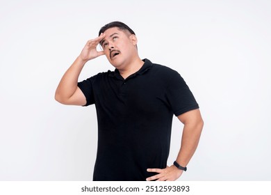 A middle aged man feeling dizzy and disoriented. Touching his forehead. Isolated on a white background. - Powered by Shutterstock