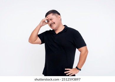 A middle aged man feeling lightheaded or confused. Touching his forehead. Isolated on a white background. - Powered by Shutterstock