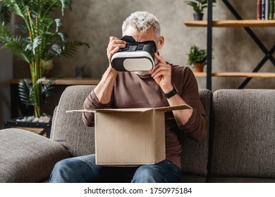 Middle aged man got his delivery with vr box at home - Powered by Shutterstock