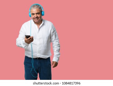 Middle Aged Man Happy And Fun, Listening To Music, Modern Headphones, Happy Feeling The Sound And Rhythm